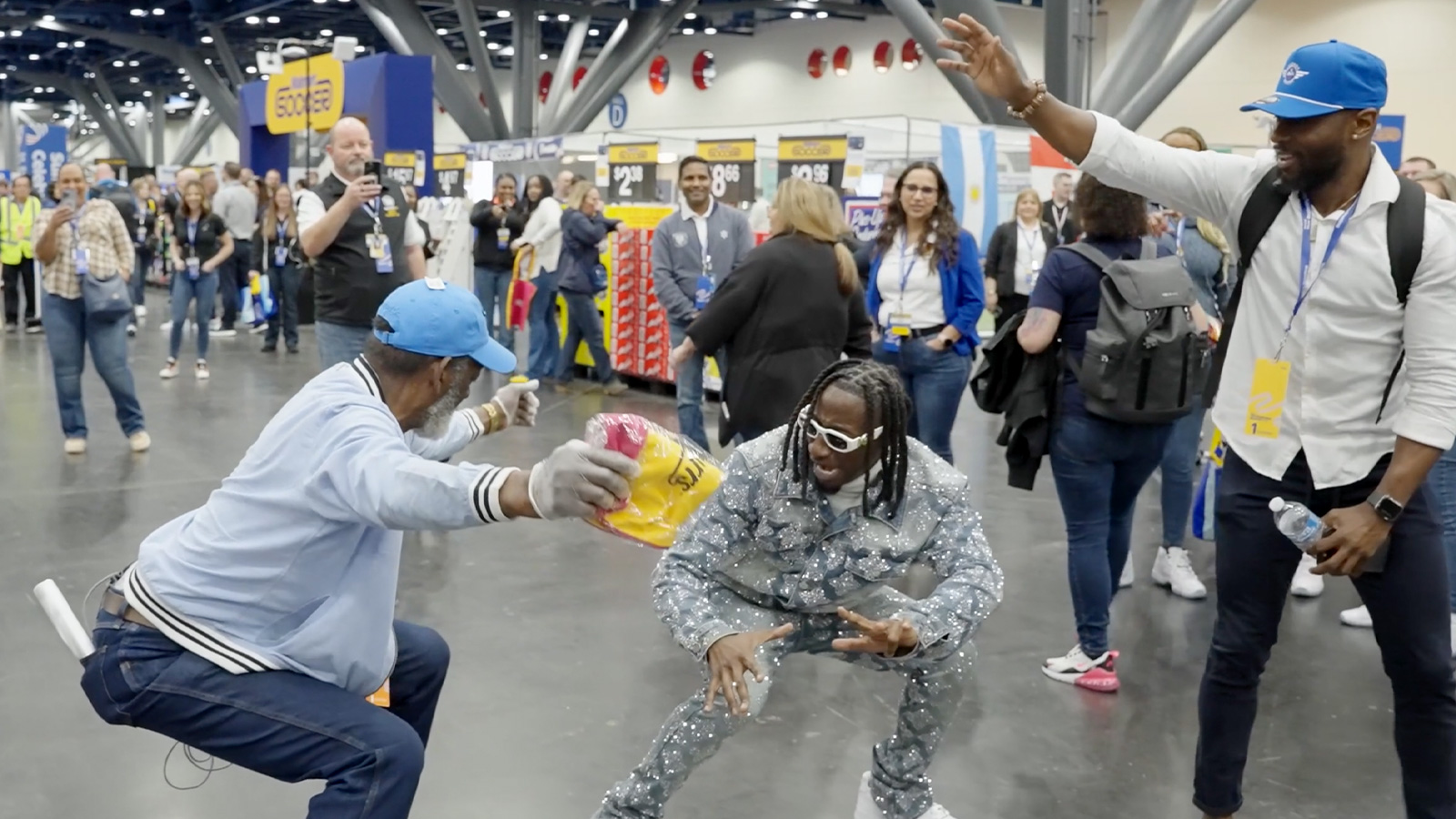 Viral sensation Swisher3X dances with a Walmart associate.