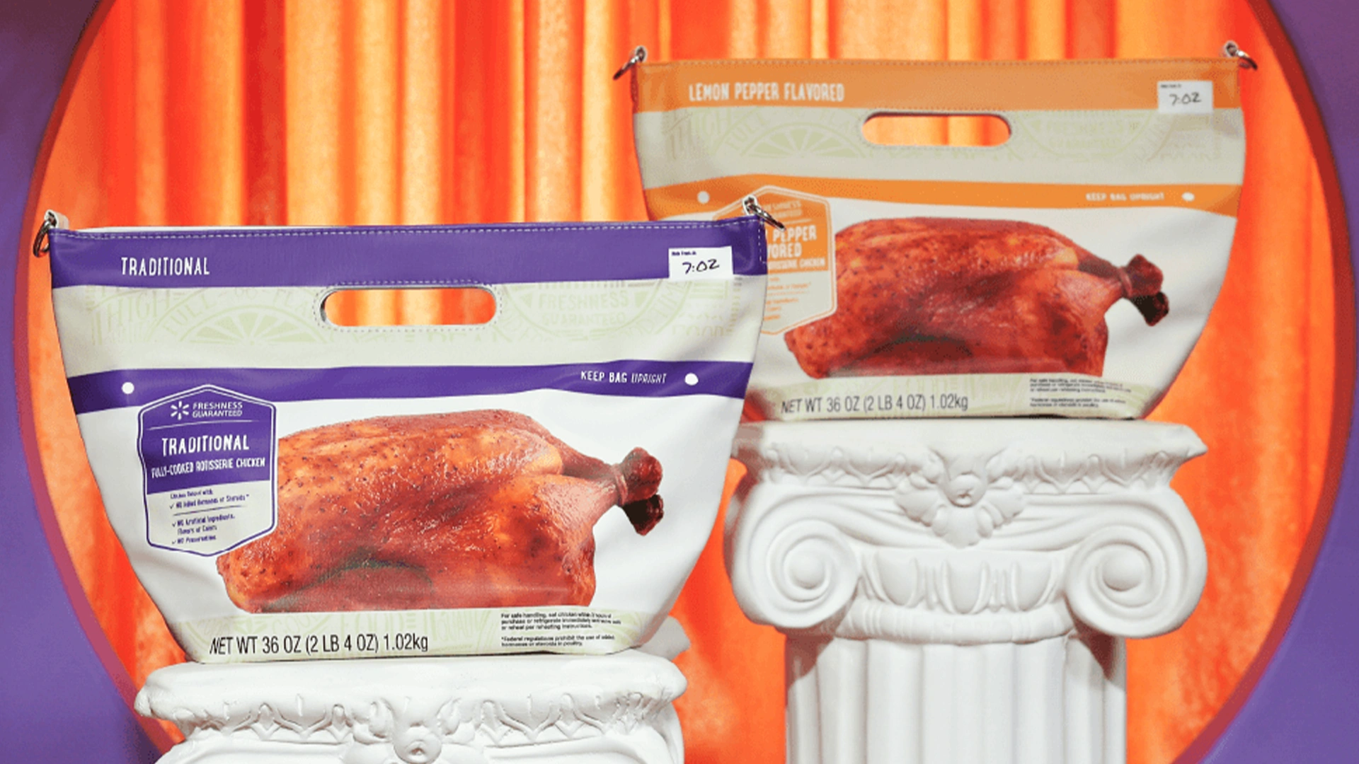 Two large bags of roasted chicken are showcased on white decorative pedestals. The front bag features a traditional flavor design with purple accents, while the rear bag shows a lemon pepper flavored variant in warm beige tones. Both bags highlight a whole roasted chicken image against a colorful orange and purple curtain backdrop. Text on the front bag includes "TRADITIONAL" and "NET WT 36 OZ (2 LB 4 OZ) (1.02kg)".