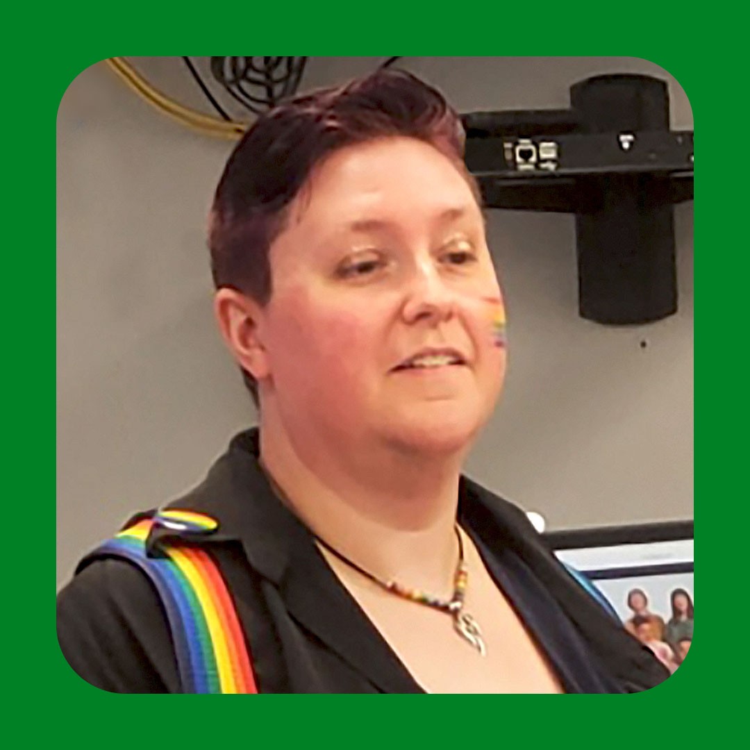 Walmart associate with short hair speaking.
