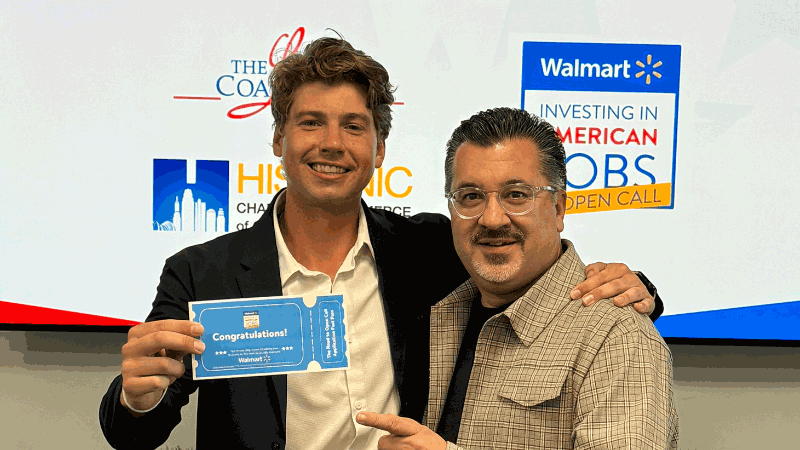 Mark Espinoza poses with an Open Call ticket winner.